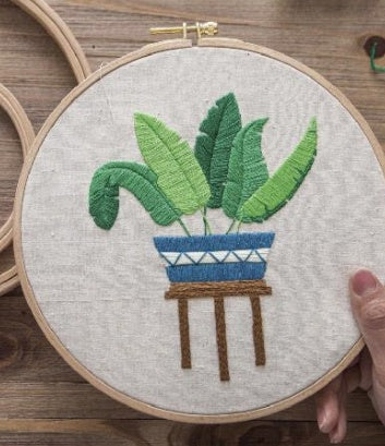 Cross stitch of green plants